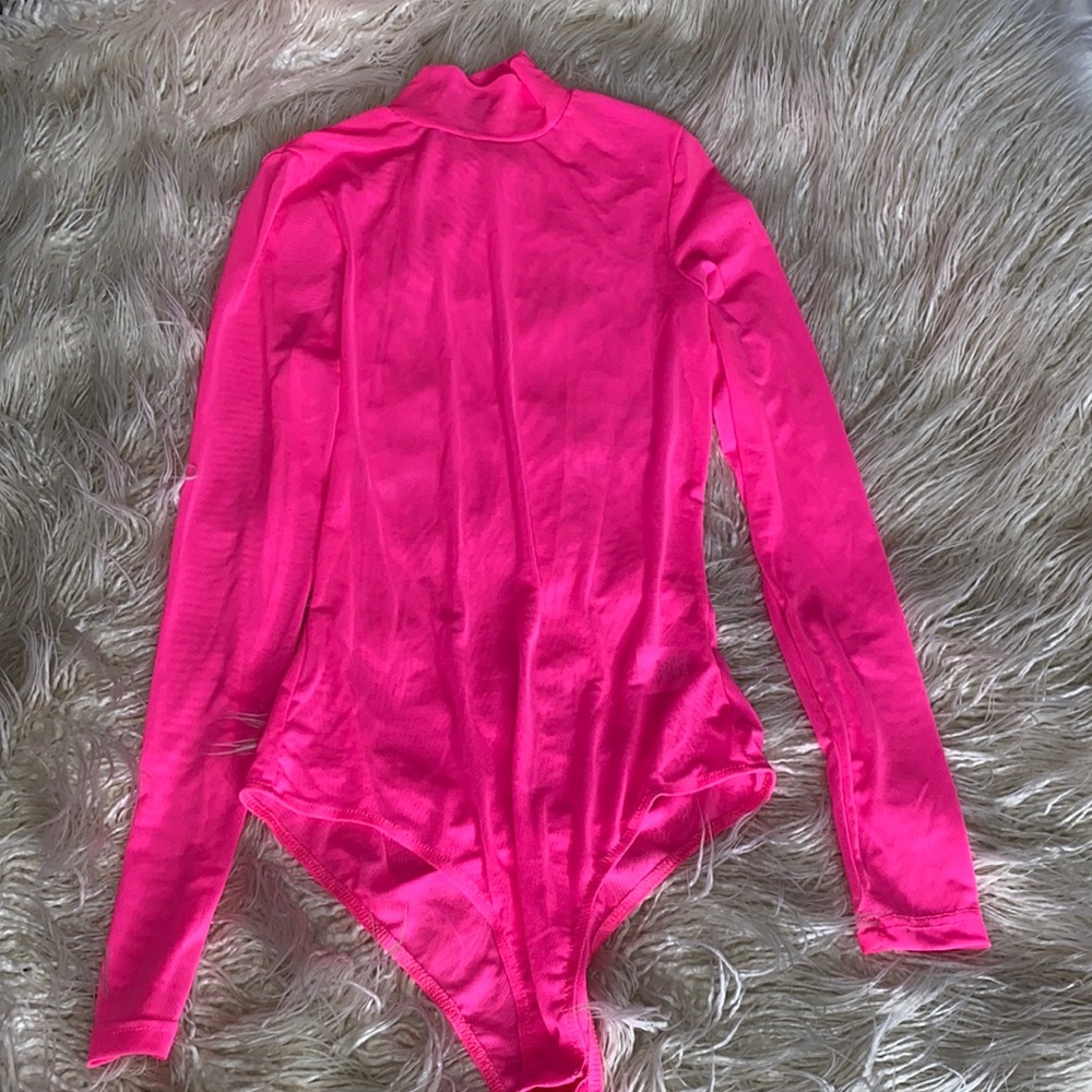 Small bright pink body suit